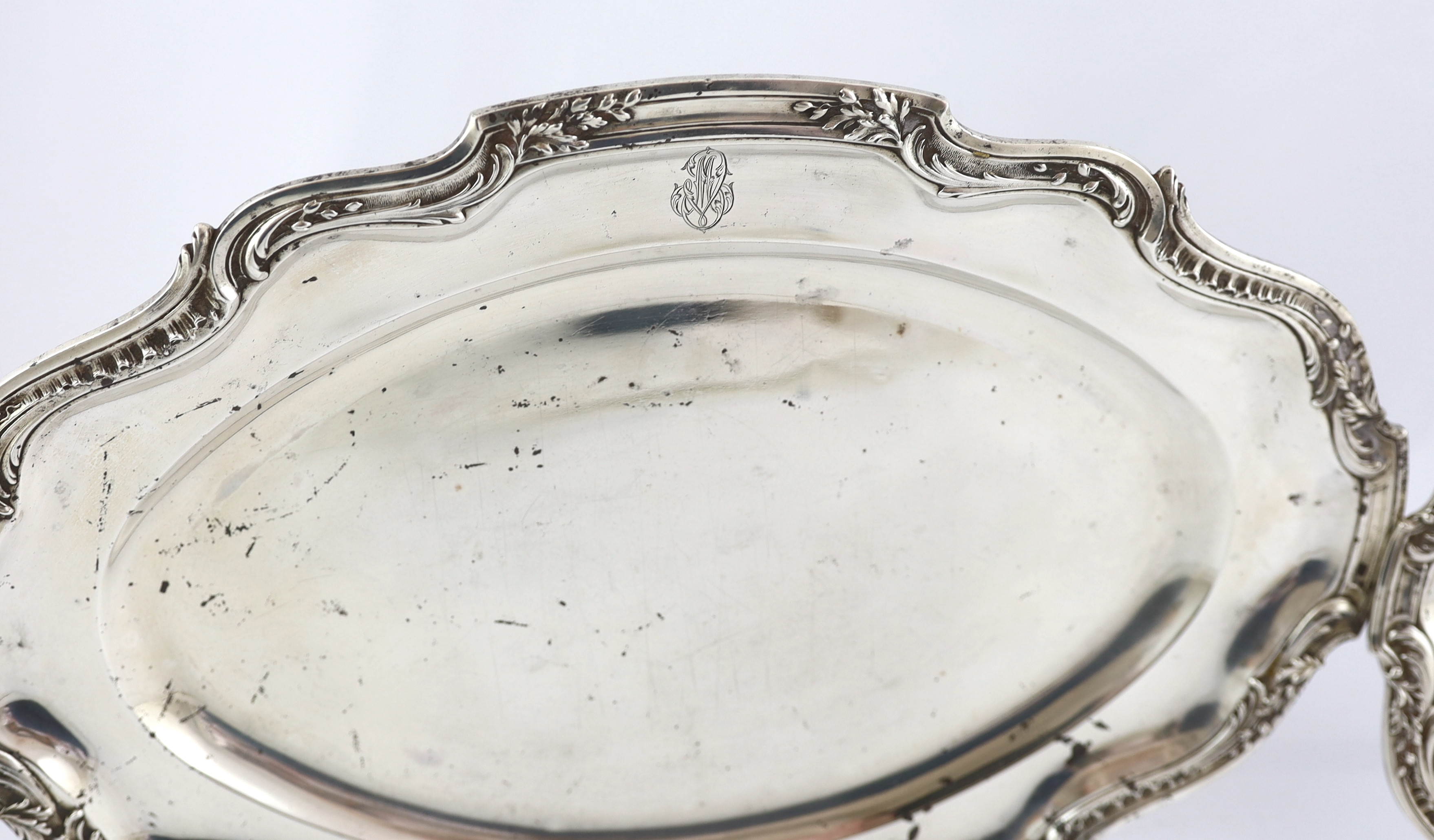 A late 19th century French 950 standard silver tureen and cover, a sauceboat on fixed stand and two serving dishes, by V. Boivin, Paris